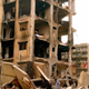 <p><b>NEW BEGINNINGS</b><br>
Now unencumbered by hate or bitterness, Lebanese men walk through the rubble of their former apartment buildings.</p>